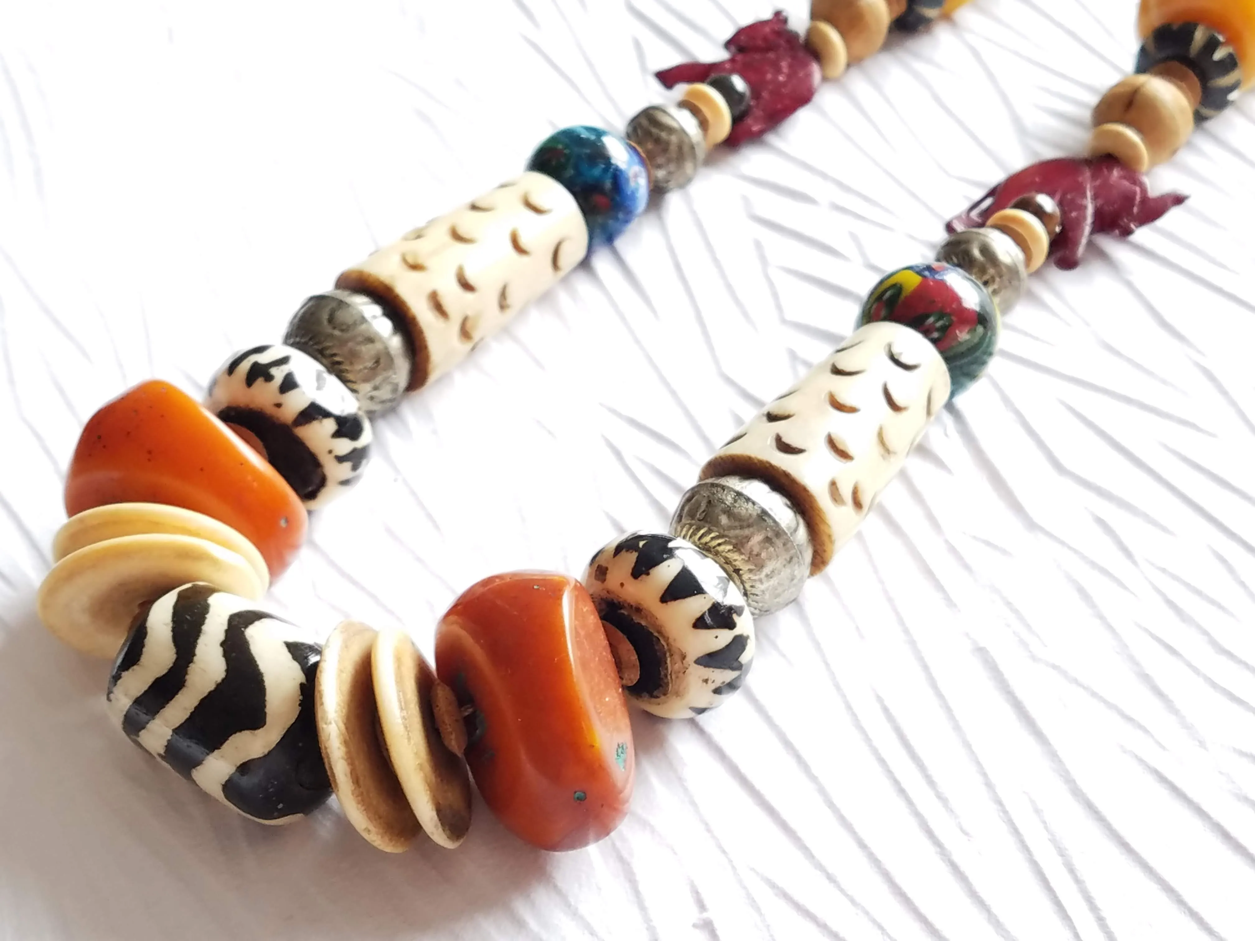 Carved Bone and Horn, Copal Amber Resin Batik Bone Lampwork Glass Elephant Casual Statement Necklace, The Juke Joint