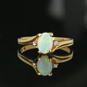 Charming Diamond Accent Opal Solitaire Ring in Gold