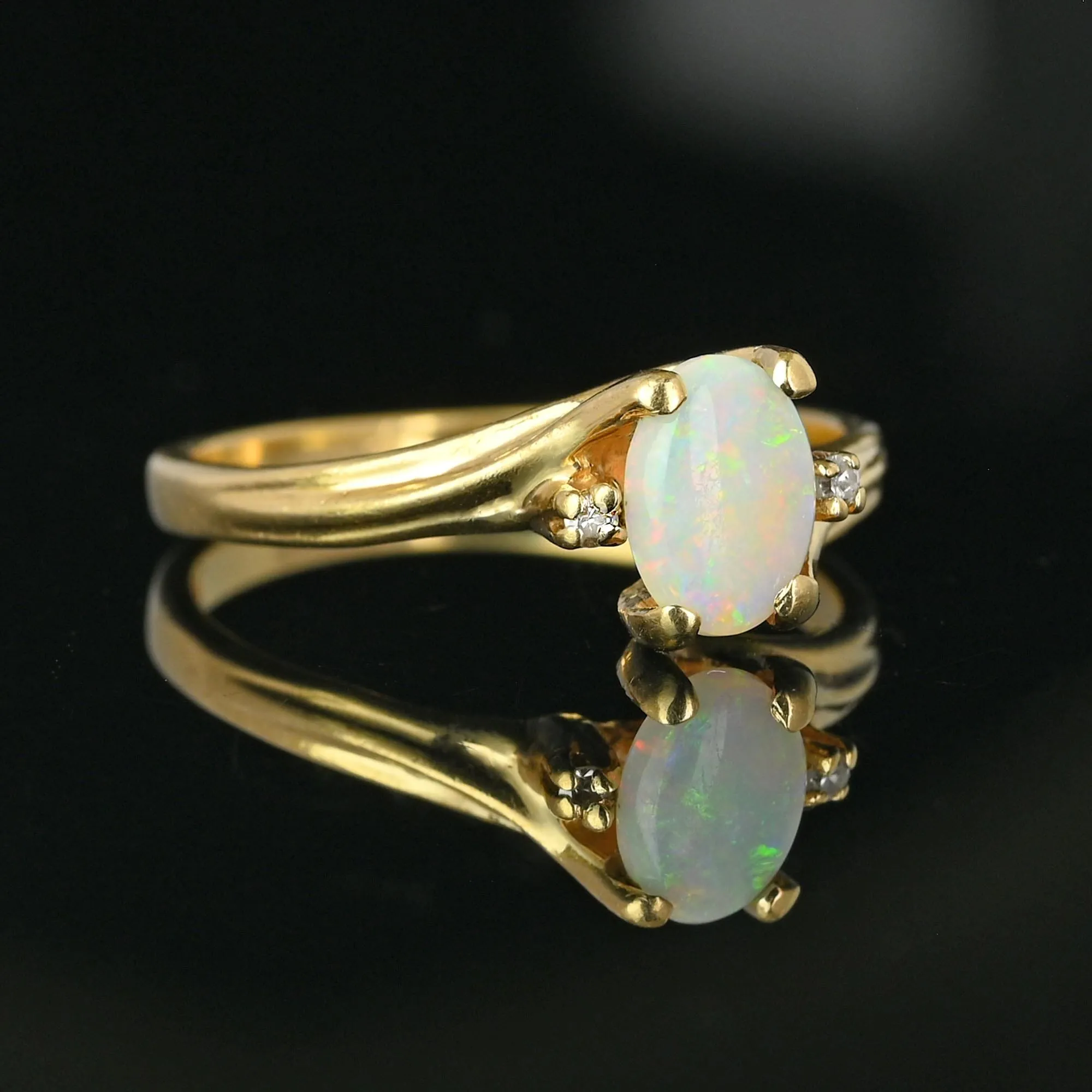 Charming Diamond Accent Opal Solitaire Ring in Gold