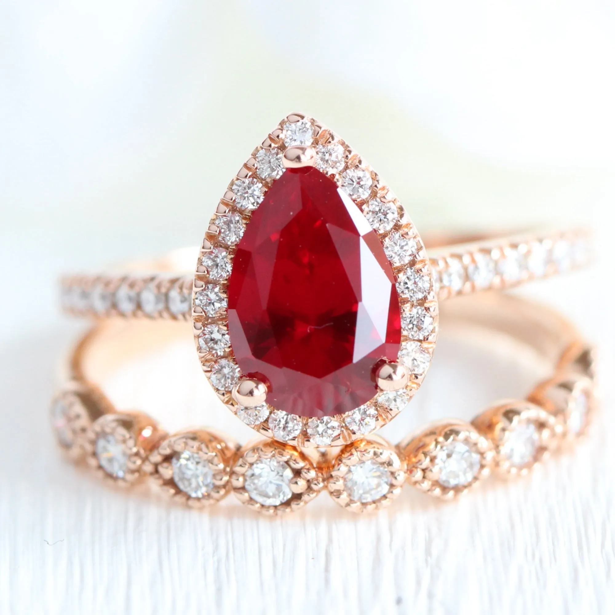 Pear Ruby Engagement Ring in Luna Halo Diamond Pave Band